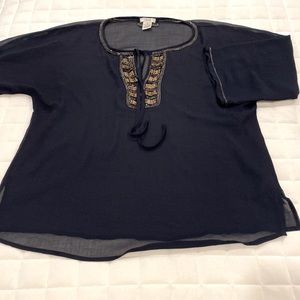 Cache blouse with beading accent.
